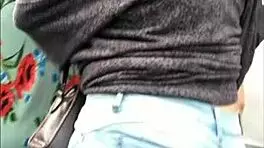 teen latina with tight jeans showing off her curves in a voyeur scene