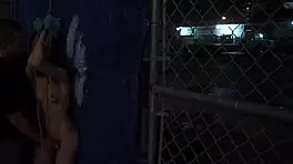 teen bends over for dildo domination in rough outdoor doggystyle bondage.