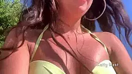 Look at this crazy girl peeing in her panties on the beach!