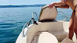 blonde housewife washes boat in sexy thong swimsuit for summer fun.