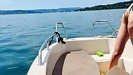 blonde housewife washes boat in sexy thong swimsuit for summer fun.