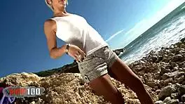 Stunning blonde Nicky Wayne strips by the sea. Her European charm shines in this beach reveal.