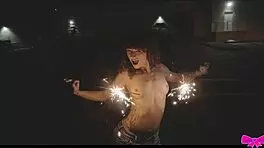 Just chilling topless outdoors with Honey Gold and Dakota Marr flashing sparklers.