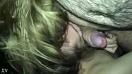 The teen is giving a blowjob, sucking and licking the young guy's cock