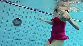 Anna netrebko teases in bikini while swimming in the pool, showing off her petite figure.