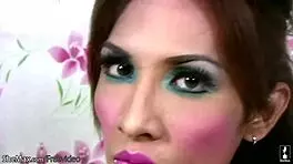 Watch this pretty ladyboy tease her small tits and shaved cock in lingerie.