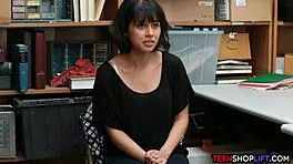 teen shoplifter gives a reluctant blowjob to the security guard in the back room