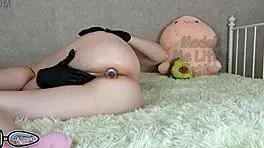 Wearing fetish latex gloves with butt plug for close-up personal play session