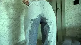 Petite teen experiences desperation pee in homemade video