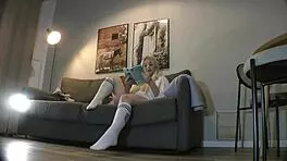 Busty milf casually strips panties on couch while reading
