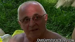 Outdoor teen swallows old man's cock boldly