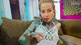 Tattoo girl feels pleasure in solo anal play with big dildo in sexy fishnets