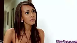 Uniform teen undresses, showing her ass and small tits.