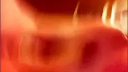 Two young brunette lesbians explore each other passionately on the soft bed.