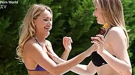 Sexy bffs Polly Yangs and Merida Sat share glass dildo in outdoor cunilingus by pool