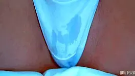 Sexy latin girl shows off her big round ass in a white thong under a blue dress