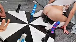 Petite girl wins orgasm playing wheel of dildos