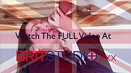 Feeling naughty, uniformed brunette Ellie passionately milks cock at milking table.