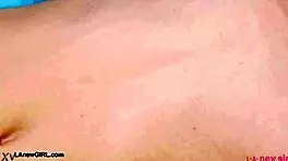 Red-haired model casually reveals her sexy body on sofa.