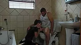 Petite slut performs oral on cock in toilet