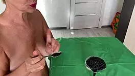 Tell me, how does this mature woman milk her partner's balls?