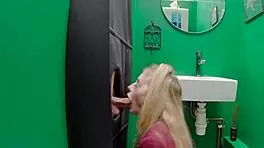 Teen eagerly sucks cock at the gloryhole