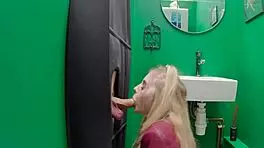 Teen eagerly sucks cock at the gloryhole