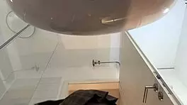 Hot blonde babe with big tits and ass strips in pantyhose and heels in bathroom