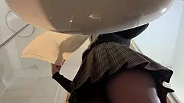 Hot blonde babe with big tits and ass strips in pantyhose and heels in bathroom