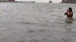 Latina beauty with big ass enjoys beach fun