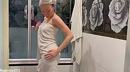 My ex-wife prepares for a sex date in the bathroom.