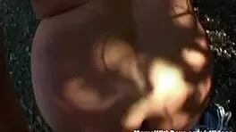 old experienced woman excites on train tracks