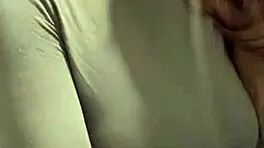 woman caresses her milky tits until she orgasms