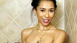 Petite brunette model showers alone