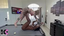 strong powerful woman lifts and carries petite blonde