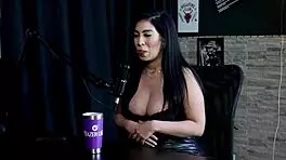 Amy Yamaguchi in sheer red lingerie engages in hotwife swing with sixteen men in group sex.