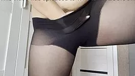 Young woman without panties in transparent pantyhose