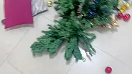 Busty young woman gives new year gift to old man.