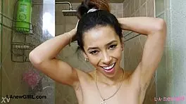 beautiful asian brunette amateur petite girl bathing in shower for photoshoot