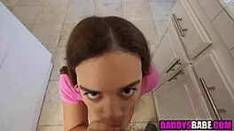 Young girl sucks cucumber before blowing older man