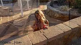 showing myself in a pink microbikini