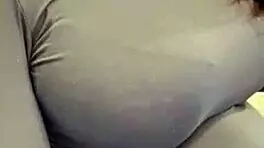 The pregnant woman pulls her milky tits out of her red bra