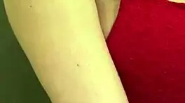 The pregnant woman pulls her milky tits out of her red bra