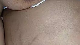 Is this ebony woman masturbating in her room alone?