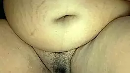Is this ebony woman masturbating in her room alone?