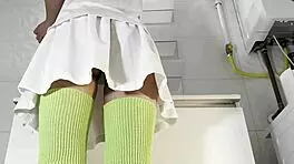 Hot Brunette College Girl With A Mini Tennis Skirt And Over Knee Socks In The Bathroom Shows Panties Under Her Short Skirt And Goes Also No Panties