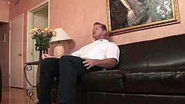 A real bear fucks petite blonde on leather couch