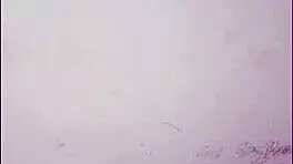 opening her pussy and inserting a pink dildo she shows her wet pussy