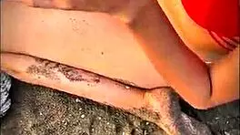 brunette latina babe gives pov blowjob on public beach