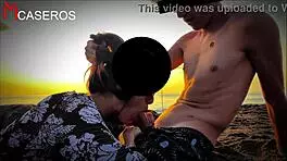 brunette latina babe gives pov blowjob on public beach